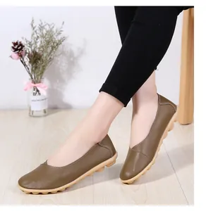 Comfortable women's brown genuine leather loafers with soft rubber sole shown on model