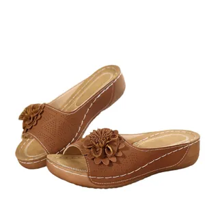 Elegant brown wedge sandals with floral upper and contrast stitching for summer