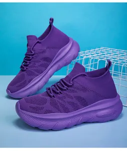 Detail showing the purple fly-knit texture and thick sole of these casual sock sneakers.