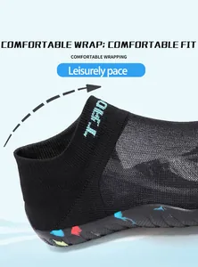 Macro view of the breathable mesh fabric and elastic collar on these black wading shoes
