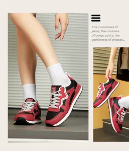 Detail view of stylish red and black retro casual sneakers for women in a lifestyle setting