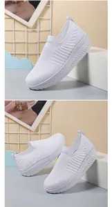 Detailed view of women's white knitted slip-on walking shoes with a rocker sole design