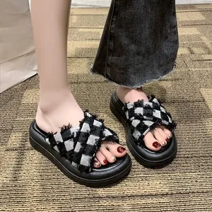 Stylish women's thick-soled plaid slippers with crisscross straps for summer wear.