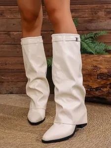 Close-up detail of stylish off-white slouchy high-heel boots featuring a sturdy chunky heel