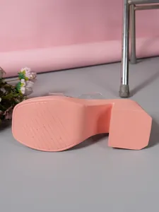 Detailed view of pink platform slipper sole with anti-slip texture and size 230.