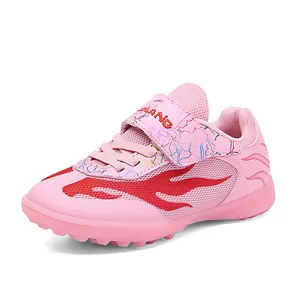 Pink breathable children's soccer shoes with red flame mesh design for turf play