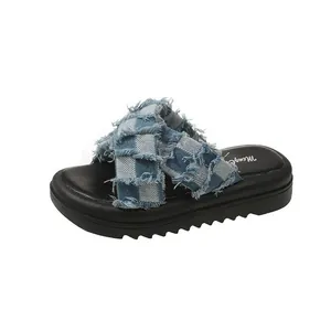 Stylish women's chunky platform slides featuring frayed blue and white gingham cross straps.