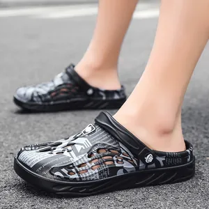Stylish lightweight men's garden clogs featuring a modern black and white pattern print