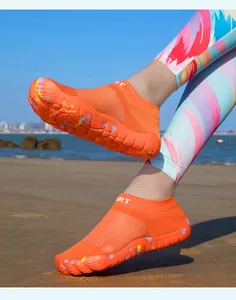 Detail showing lightweight orange barefoot water shoes for beach and outdoor fitness activities