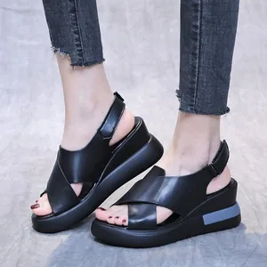 Stylish black leather wedge platform sandals with comfortable cross straps for summer