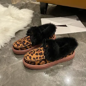 Mocassins d'hiver à imprimé léopard avec bordure en fourrure noire et nœud