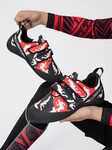 Close-up of professional bouldering shoes with red camouflage and velcro straps