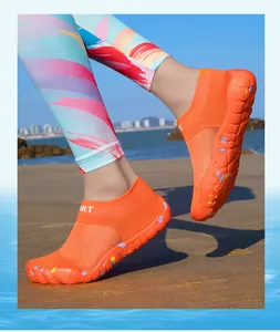 Detailed view of orange five-finger barefoot shoes for beach and outdoor water sports