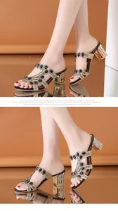 Close-up of elegant gold rhinestone chunky heel mules with black gemstone accents