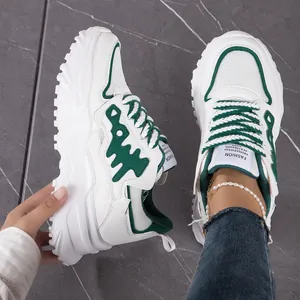 Breathable white and green chunky sneakers with mesh upper and thick platform sole