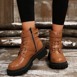 Women's brown retro biker boots with side zipper and buckle detail on platform sole