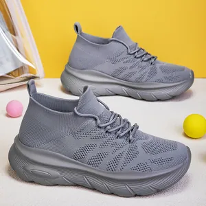 Breathable grey flyknit sock sneakers for men and women with thick cushioned sole design