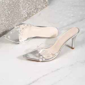 Elegant silver stiletto mules featuring a transparent pearl strap and stylish pointed toe
