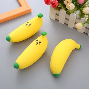 Detail view of three banana-shaped TPR squeeze toys with cute cartoon expressions