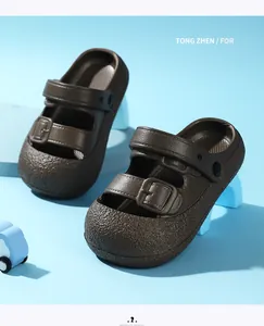 Close-up of brown textured children's sandals with double buckle straps