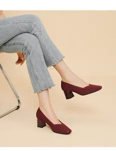 Detail shot of burgundy ribbed knit chunky heel pumps with a stylish square toe