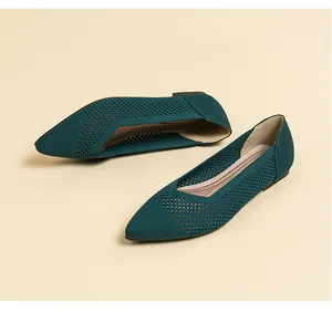 Top view detail of breathable knit pointed-toe flats in elegant teal green finish.