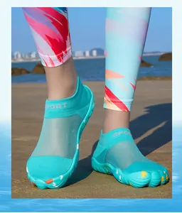 Close-up view of breathable turquoise five-finger aqua shoes for beach and water sports