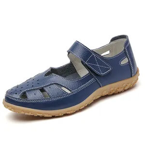 Elegant blue hollow leather loafers for women with velcro strap and white stitching