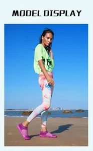 Full body model display of purple five-finger water shoes on a sunny sandy beach