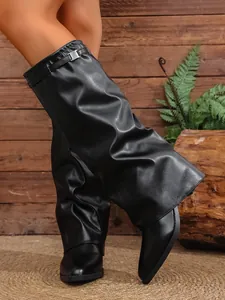 Detailed view of black pleated pant-leg high-heeled boots with chunky heel design