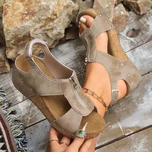 Stylish khaki wedge sandals for women featuring front zipper and stud details