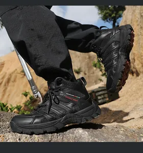 Men's black mid-cut outdoor hiking boots shown on rocky terrain for rugged trekking
