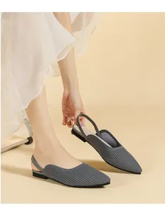 Detail of grey knit pointed-toe slingback flats showing ribbed texture and comfort