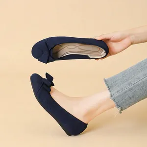 Classic navy blue flyknit ballet flats with an elegant bow and comfortable flat sole