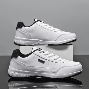 White leather casual sneakers with waterproof tag for men, stylish athletic board shoes.