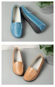 Detailed view of blue and camel textured leather loafers featuring durable non-slip soles