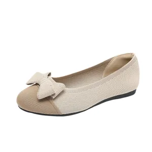 Elegant beige fly-knit ballet flats with a stylish bow accent for fashionable women