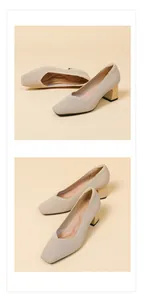 Detail view of beige square-toe knit pumps with chunky gold heels.