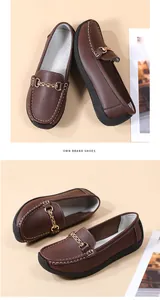 Detailed view of brown leather loafers with gold chain buckle and flexible soft sole