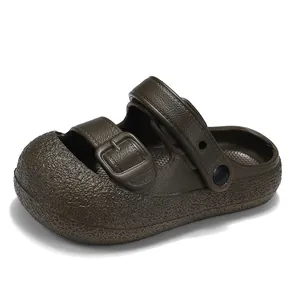 Dark brown children's closed-toe sandals with dual buckle straps for summer