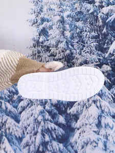 Detailed macro view of white non-slip rubber sole for women's warm winter cotton shoes