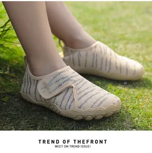 Close-up of breathable mesh toddler beach shoes with zebra pattern and soft sole.
