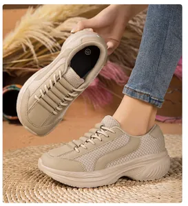 Detail of breathable beige thick-soled sneakers with mesh and leather panels
