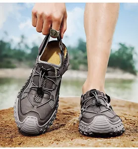 Detail of grey men's slip-on casual sandals with toggle laces and durable rubber soles