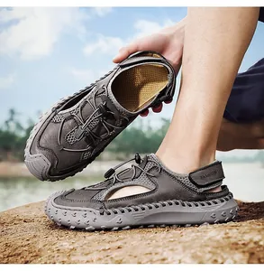 Close-up of gray genuine leather outdoor sandals with breathable hollow-out design