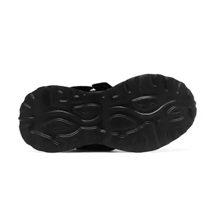 Detailed view of the durable textured black rubber outsole of women's chunky sneakers