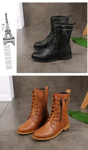 Vue détaillée de bottines de combat à lacets noires et marron avec fermeture éclair