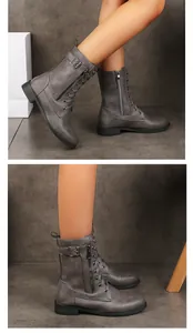 Vue détaillée de la fermeture éclair latérale sur les bottes grises à lacets pour femmes