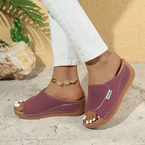 Detail shot of purple peep-toe wedge platform sandals for women in casual summer style