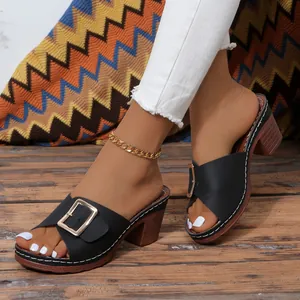 Stylish black high-heeled mules with metal buckle and chunky wood-grain heel for women